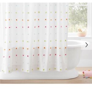 Pottery Barn Shower curtain. In almost mint condition.  Multi colored PomPoms